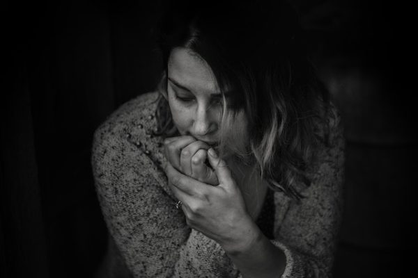 Greenwood Counseling Center woman biting her nails needing therapy in Denver Colorado