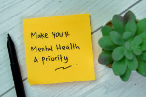 Greenwood Counseling Center with a sticky note that says make your mental health a priority