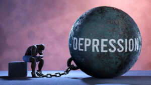 Greenwood Counseling Center depression on a weight that is chained to a man