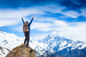 Greenwood Counseling Center man conquering a mountain after therapy