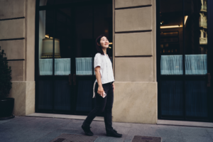 Young woman walking through the city